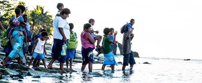 People crossing a river