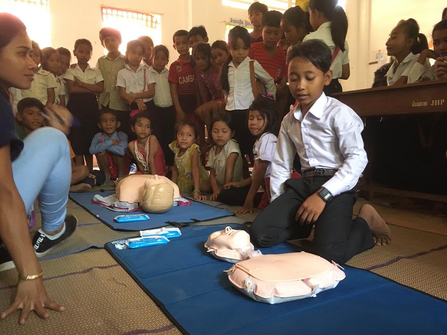 Children being taught CPR